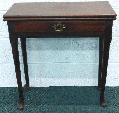 A George III mahogany foldover tea table