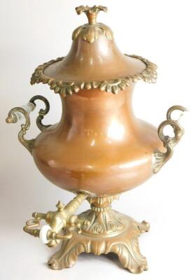 A Victorian copper and brass tea urn