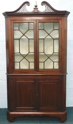 A 19thC mahogany standing corner cabinet