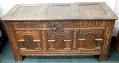 An 18thC carved oak coffer