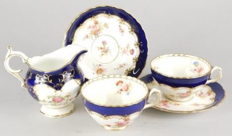 An early 20thC Coalport jug and pair of cups and saucers