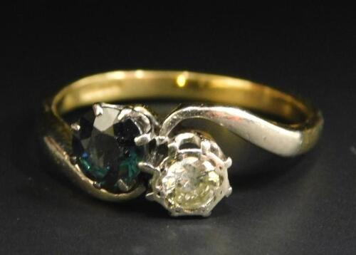 An 18ct gold sapphire and diamond twist ring