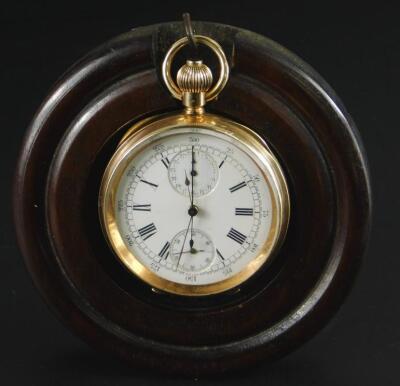 A gold open face pocket watch