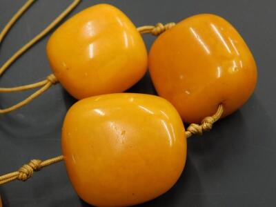 A seven bead butterscotch coloured amber necklace - 3