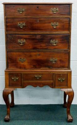 A George III walnut chest on stand