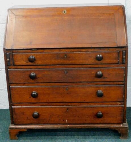 A George III oak and mahogany banded bureau