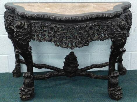 A 19thC Chinese carved hardwood console table