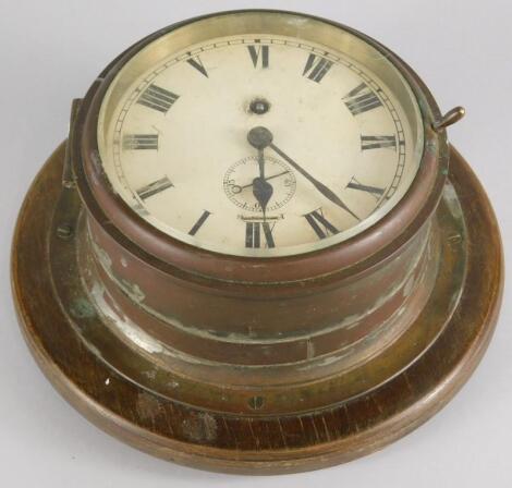 A brass ship's bulkhead wall clock