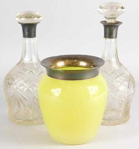 A pair of cut glass decanters