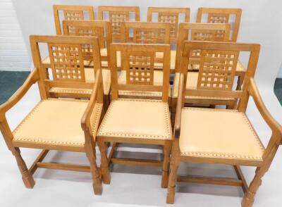 A set of ten Robert Thompson of Kilburn 'Mouseman' oak dining chairs