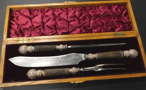 A cased three piece carving set