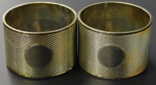 A pair of Edward VIII silver engine turned napkin rings