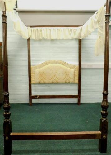 A mahogany four poster bed