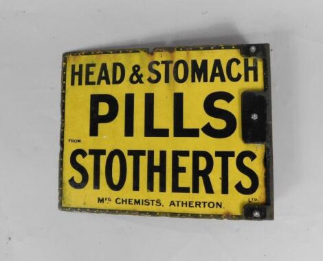 A Stotherts Ltd black and yellow rectangular enamel advertising sign