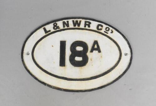 A LENWR Co 18A oval black and white cast iron sign