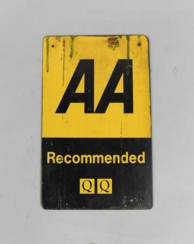 An AA Recommended QQ black and yellow metal wall plaque