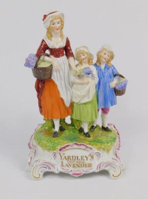 A Dresden porcelain advertising figure group