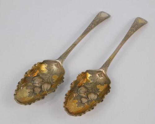 A pair of George II silver fruit spoons