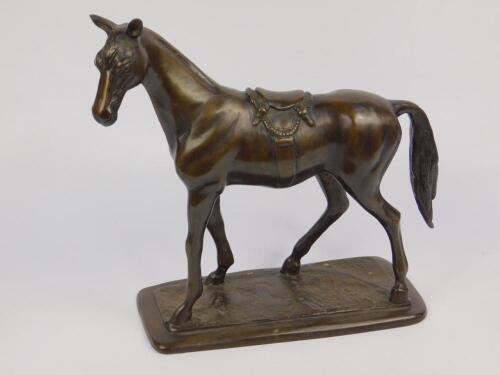 A loaded bronze figure of a horse