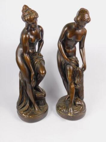 A pair of late 19thC bronzed plaster figures modelled on Venus bathing