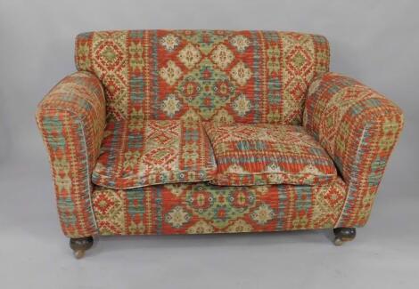 Two 1930's oak framed two seater sofas