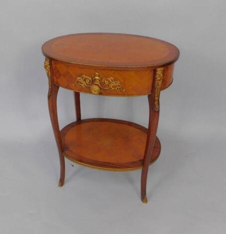 A French Kingwood and mahogany parquetry oval etagere