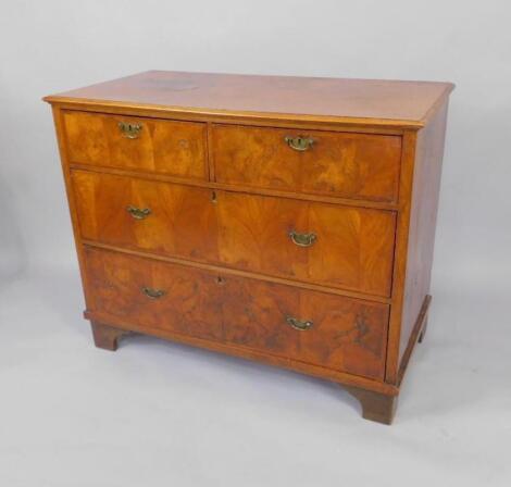 A walnut chest of drawers