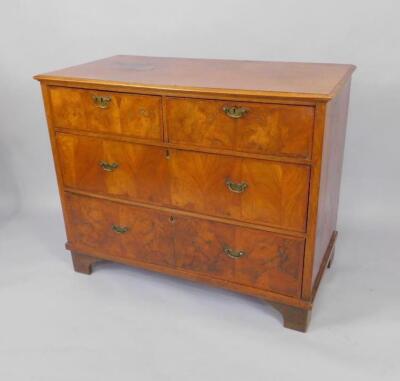 A walnut chest of drawers