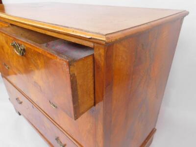 A walnut chest of drawers - 3