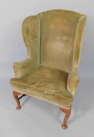 A Queen Anne walnut framed library wingback chair