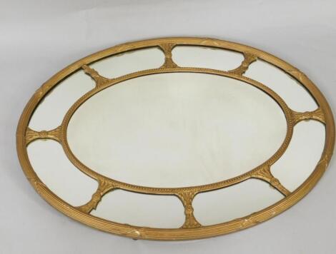 A Regency gilt framed oval wall mirror