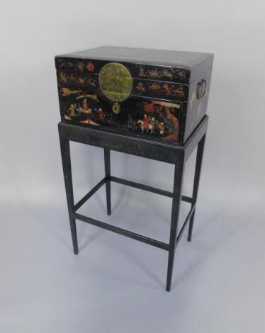 An early 19thC Chinese chinoiserie black lacquered chest