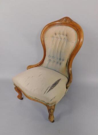 A Victorian walnut spoon back nursing chair