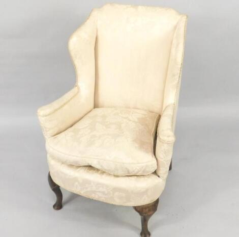 An 18thC mahogany framed wingback chair