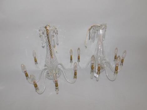 A pair of cut glass six branch chandeliers with lustre drops.