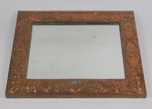 An Arts & Crafts copper framed rectangular wall mirror