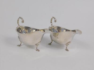 A pair of silver sauce boats