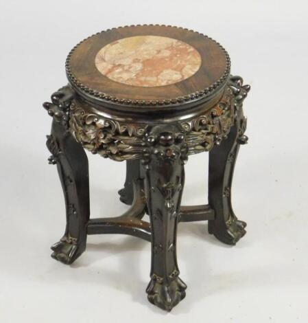 A Chinese late 19thC hardwood urn table