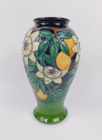 A Moorcroft pottery baluster vase decorated in the Passion Fruit pattern