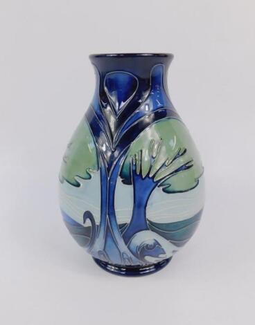 A Moorcroft pottery baluster vase decorated in the Knypersley pattern