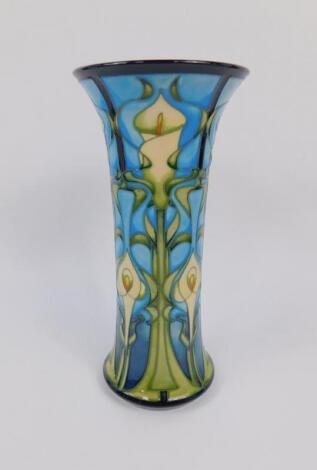 A Moorcroft pottery trumpet shaped vase decoration in the Canna Lily pattern