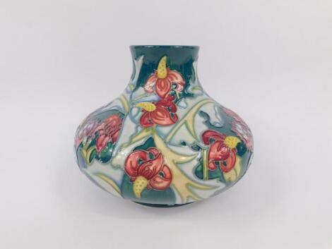 A Moorcroft pottery vase of bulbous baluster form decorated in the Leicester pattern