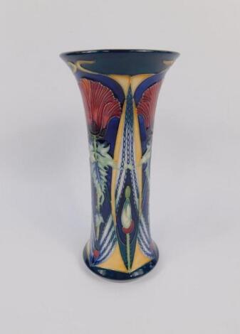 A Moorcroft pottery trumpet shaped vase decorated in the Ophir pattern