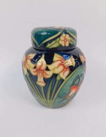 A Moorcroft pottery ginger jar and cover decorated in the Carousel pattern