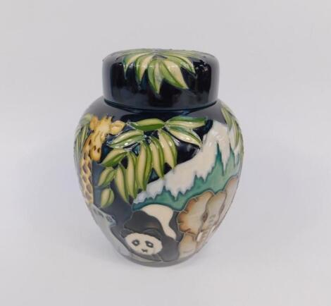 A Moorcroft pottery ginger jar and cover decorated in the Noah's Ark pattern