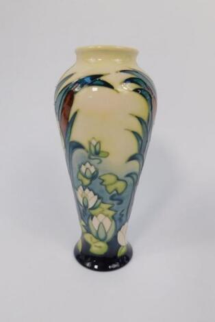 A Moorcroft pottery baluster vase decorated in the Bullrushes pattern