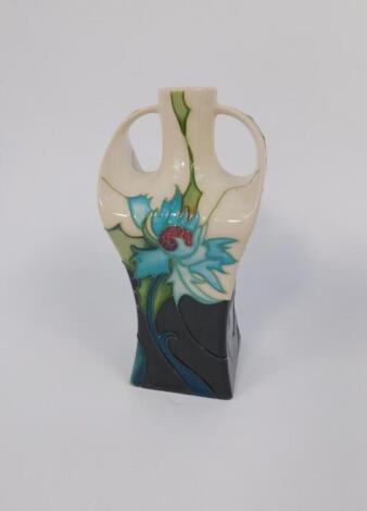 A Moorcroft pottery twin handled vase decorated in the Sea Holly pattern