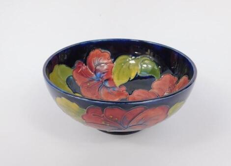 A Moorcroft pottery early 20thC bowl decorated in the Hibiscus pattern