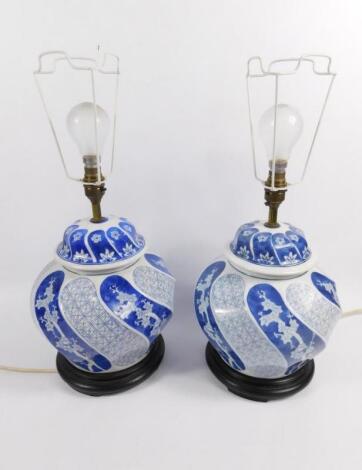 A pair of modern Chinese blue and white pottery table lamp vases