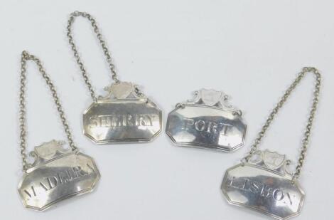 A set of four George III London silver spirit labels